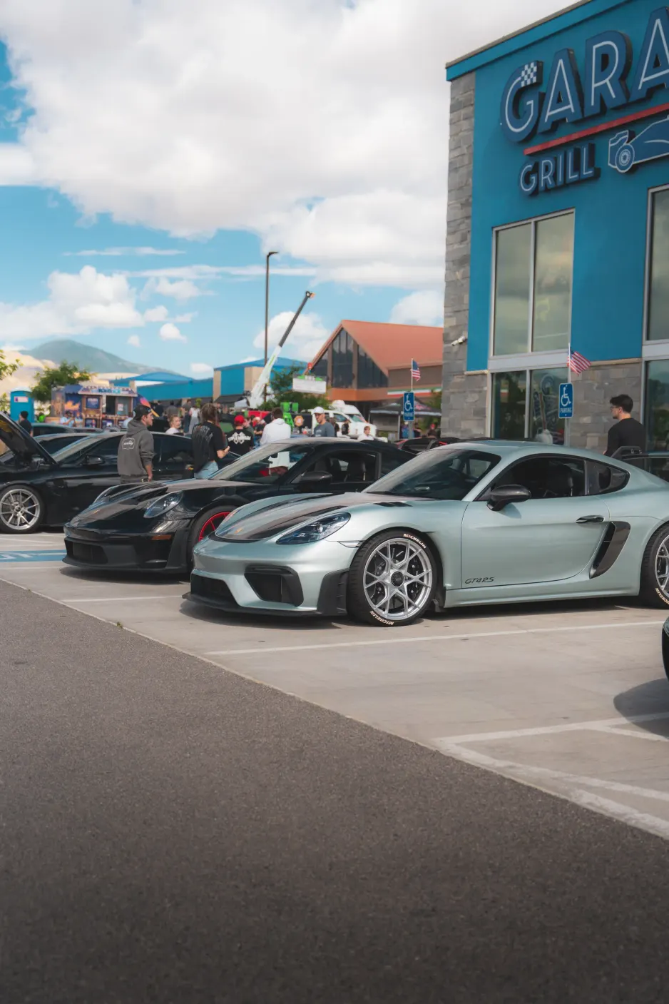 A Porsche Cayman parked outside Garage Grill